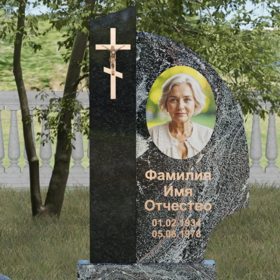 Памятник — крыло с распятием и шарами, гранит амфиболит, в Якутске