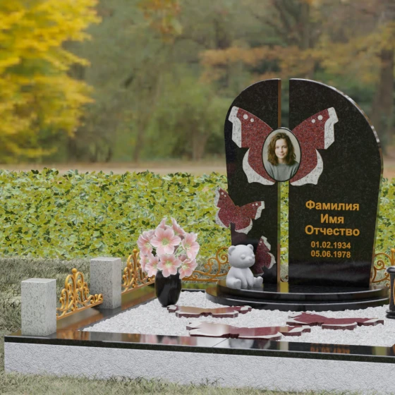 Мемориал с вертикальной стелой и крыльями бабочки, гранит Габбро-диабаз, в Якутске